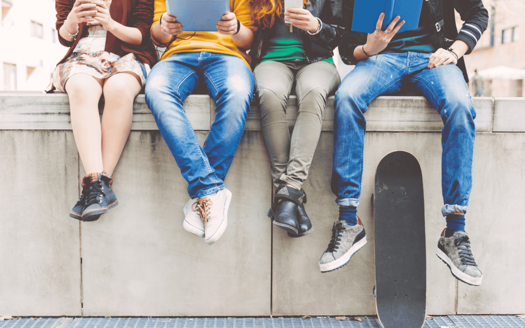 Teenage Marketing - Image of teenagers sitting on a wall.