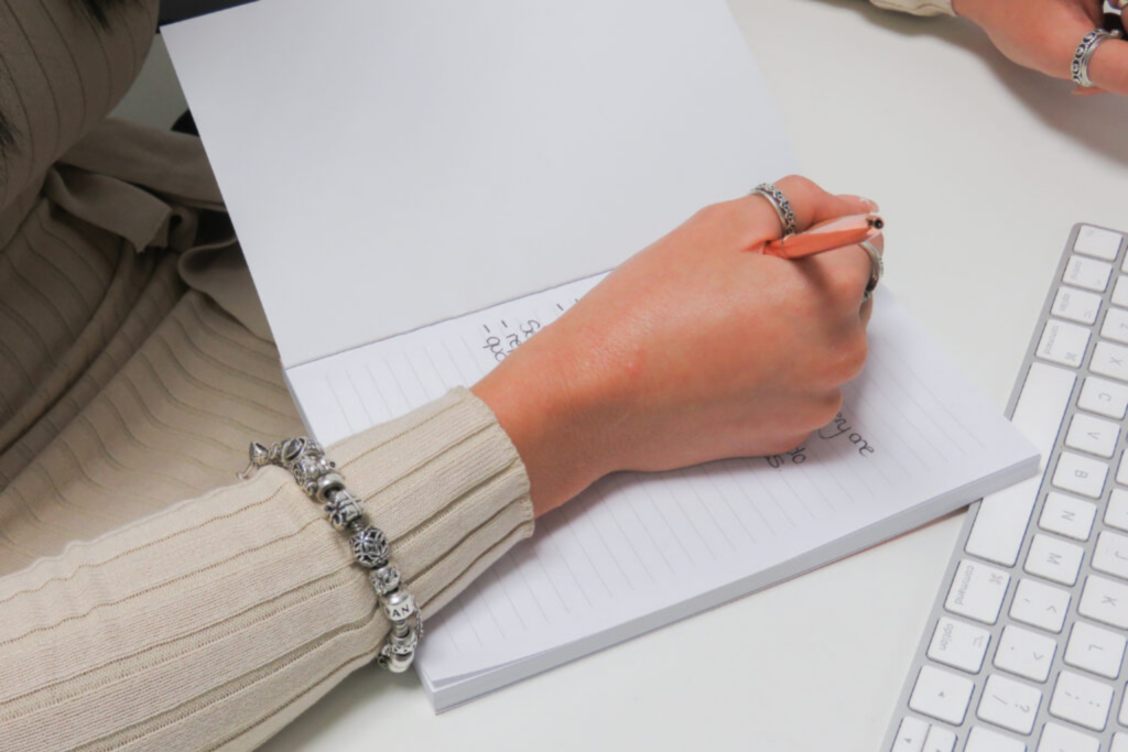Image of someone writing up a PPC digital marketing strategy