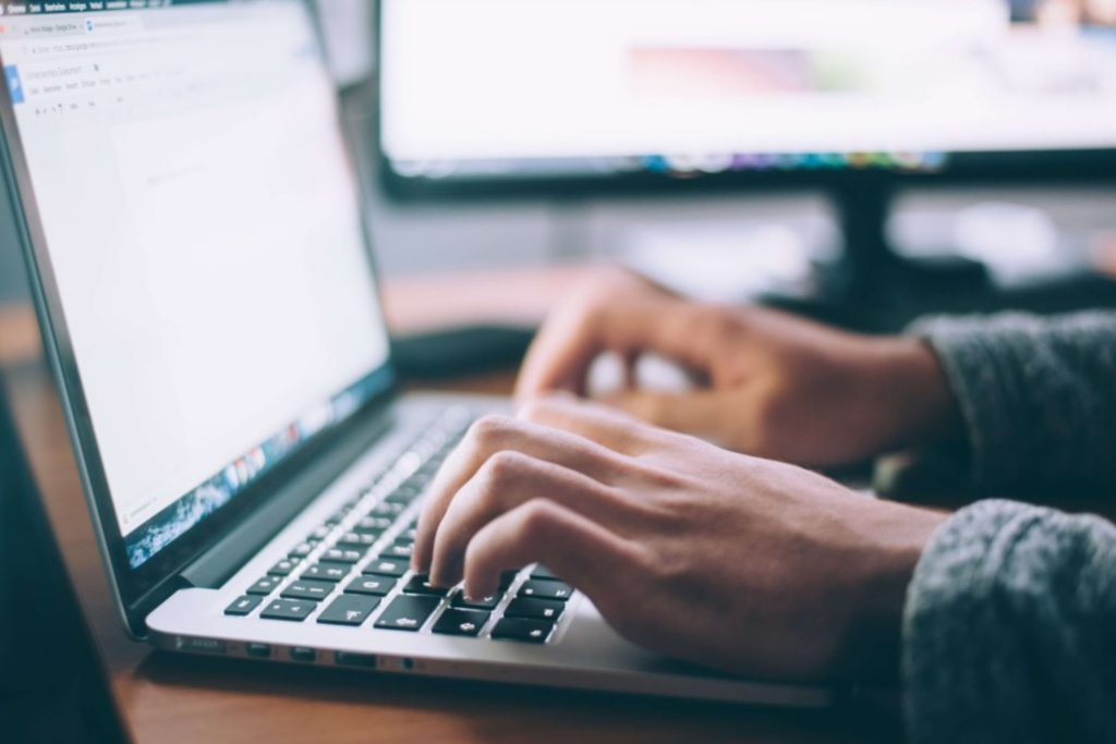 Image of someone performing SEO copywriting on a laptop.