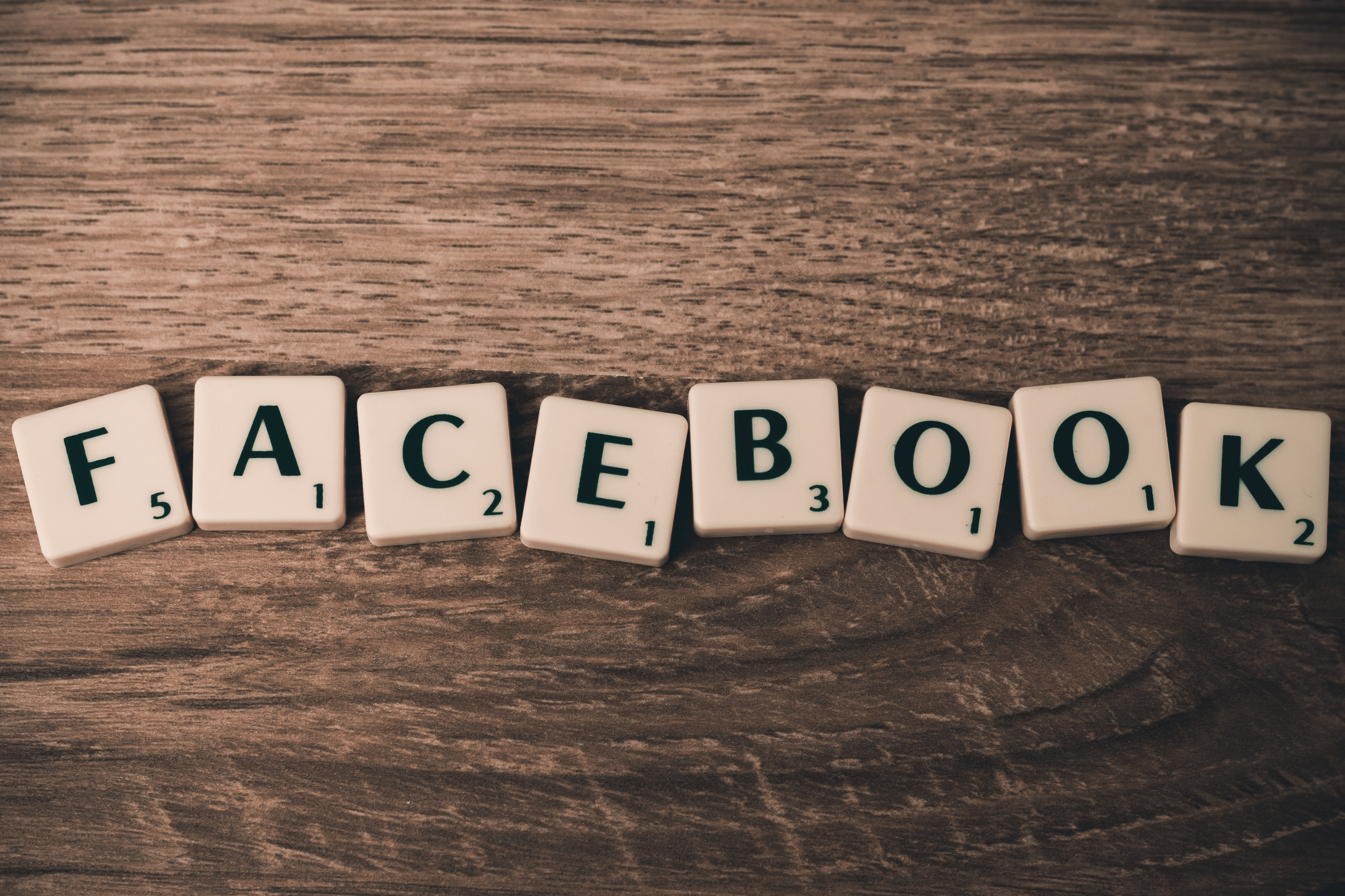 Facebook spelt in Scrabble pieces to introduce our blog titled 'Marketing On Facebook'
