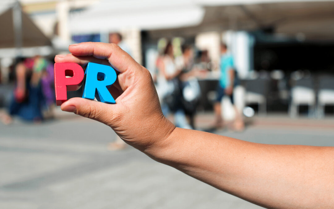 How Much Should an Essex PR Agency Charge? - Image of someone holding two plastic letters spelling out 'PR'.