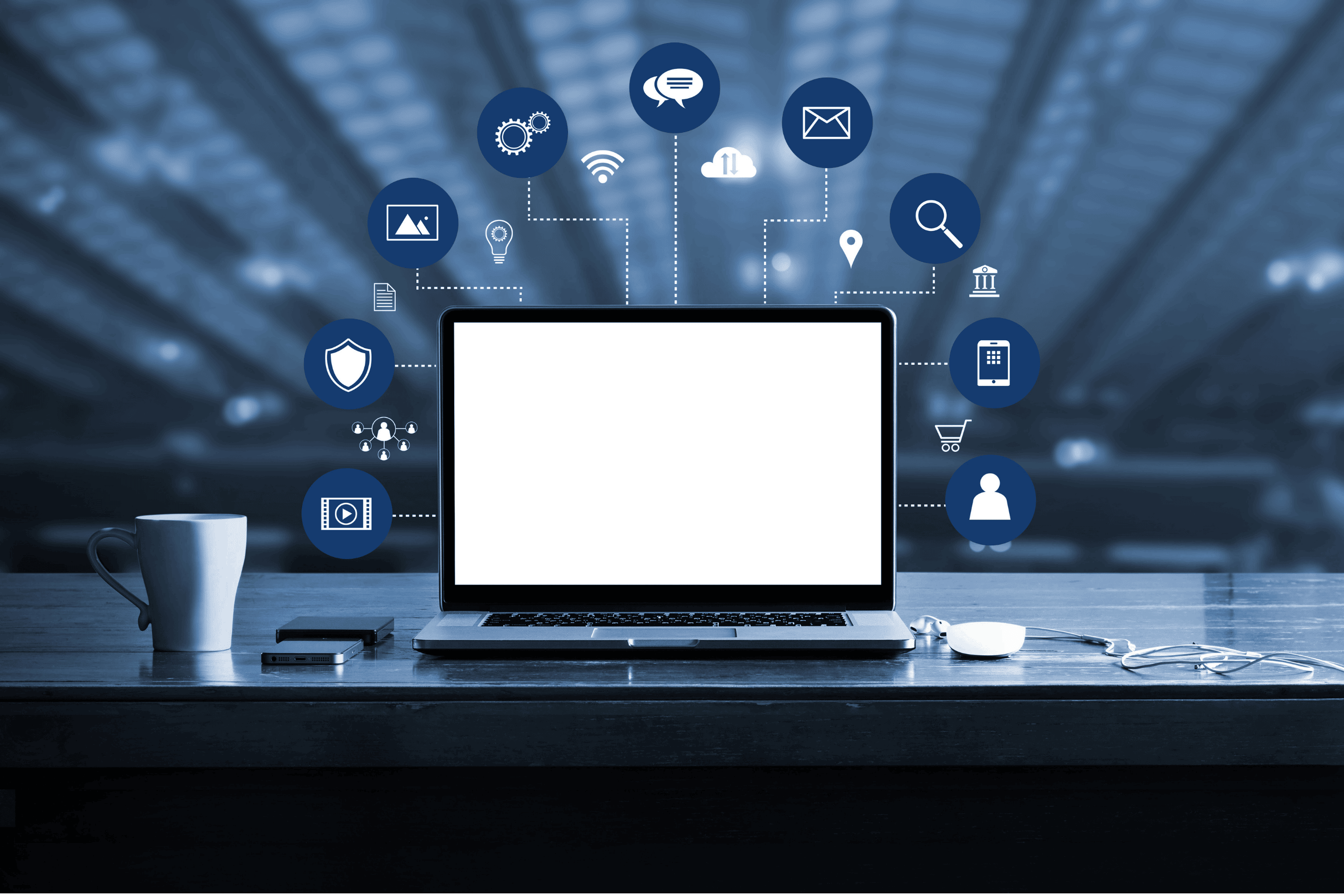 Digital Marketing Solutions - Image of a laptop screen with digital marketing icons emerging, such as a mobile phone, a magnifying glass, and a shopping cart.