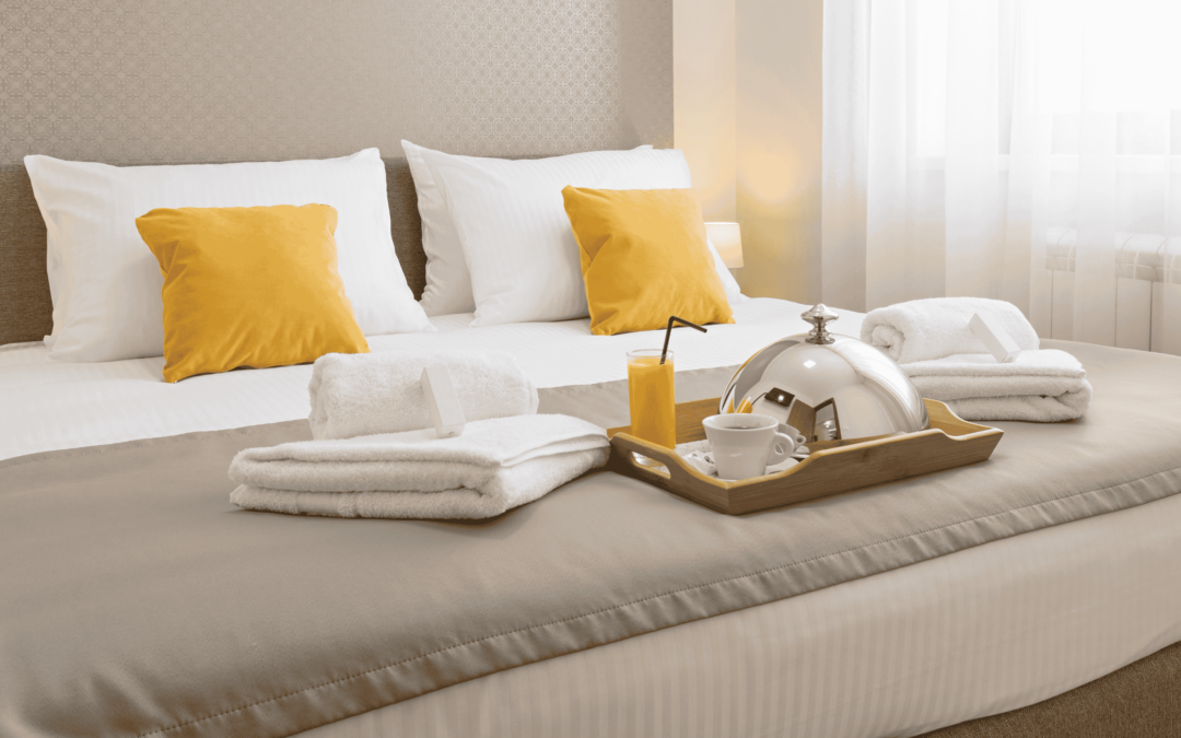 Hotel Marketing Strategies - Image of a hotel room bed.