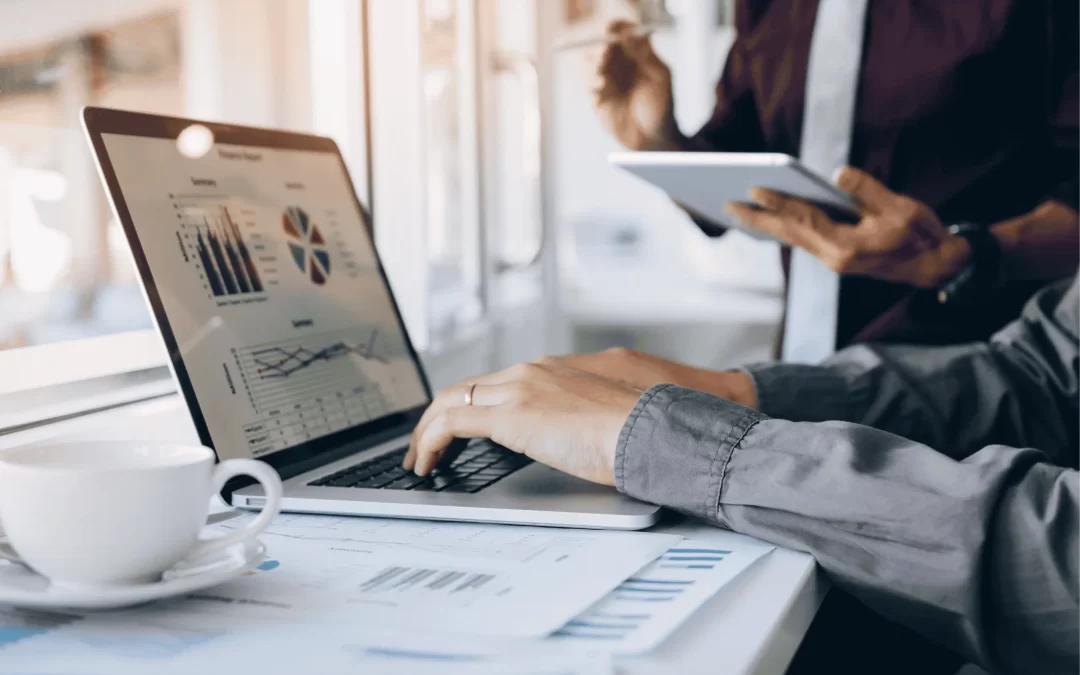 Marketing in Essex - Image of two people looking at a marketing report together.