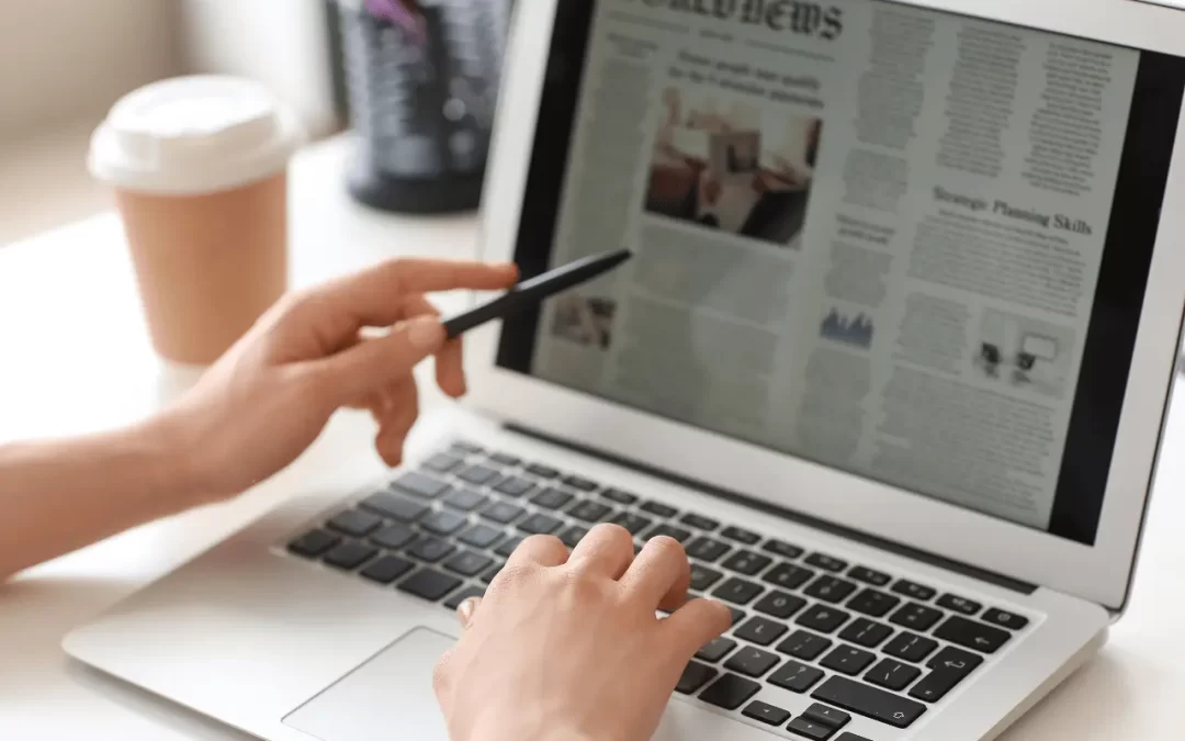 PR and Marketing - Image of someone reading a digital news article.